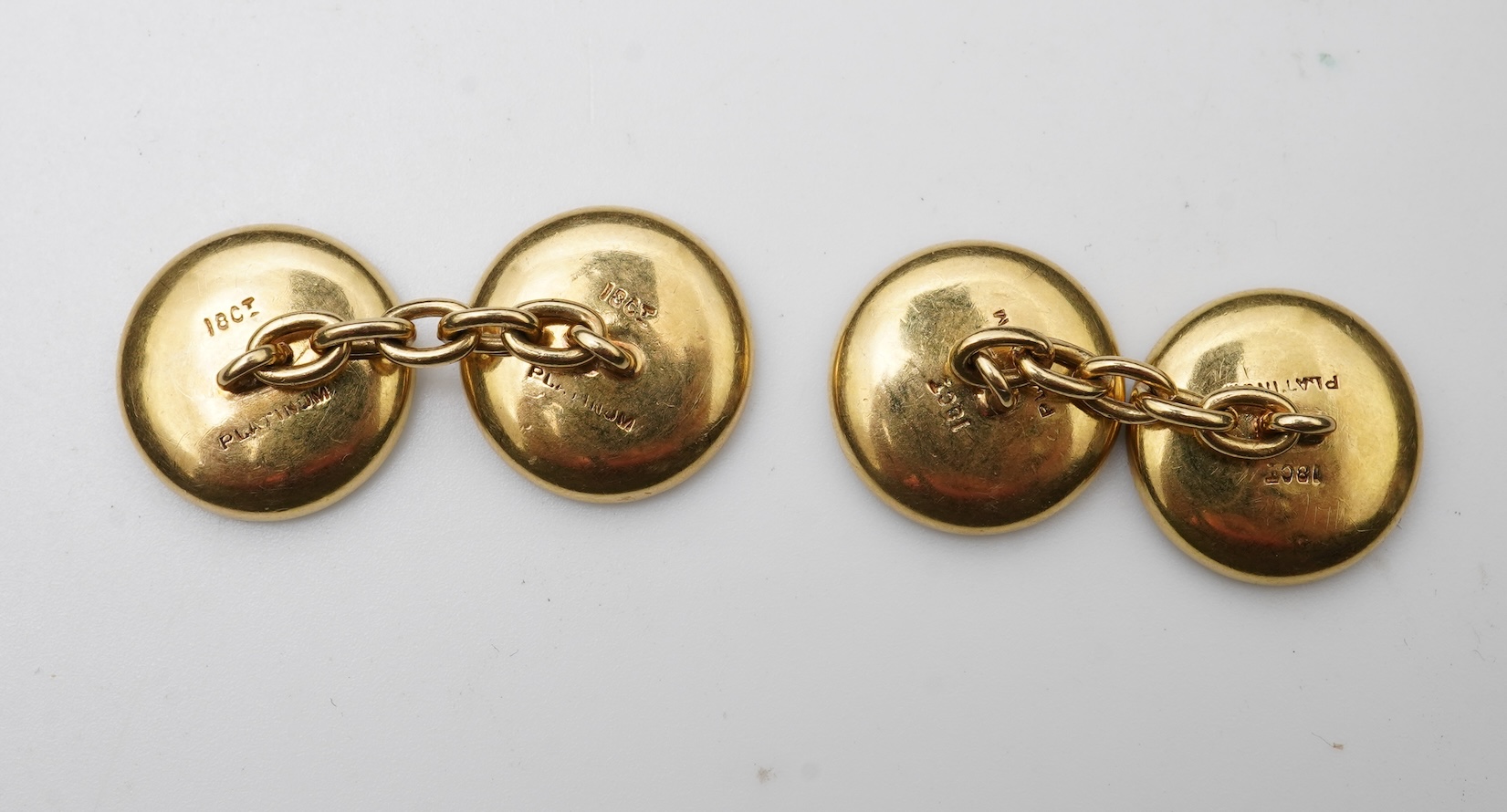 A pair of mother of pearl and sapphire cufflinks, early 20th century